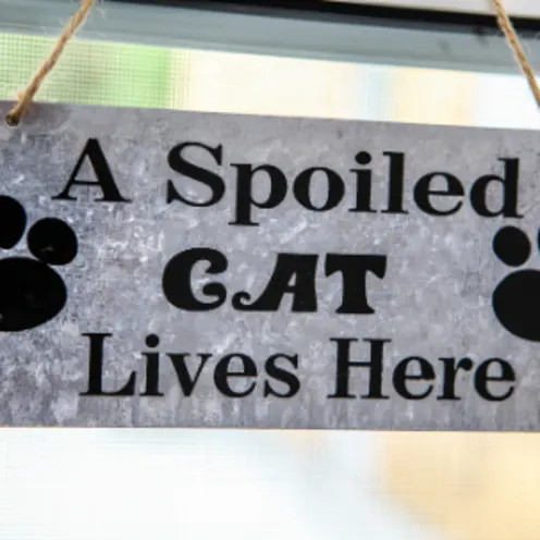 "A Spoiled Cat Lives Here" Sign